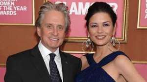 Catherine Zeta Jones with husband Michael Douglas who is battling throat cancer