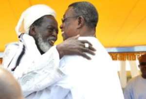 President John Evans Atta Mills in an embrace with the National Chief Imam, Sheik Nuhu Sharubutu left