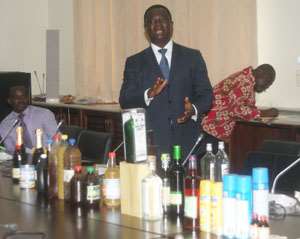 FDB Boss, Dr. Stephen Opuni showcasing some counterfeited products to members of PAC