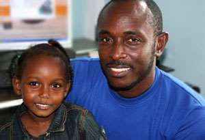 HAPPY TIMES: Godwin Nikoi Kotey with one of his kids