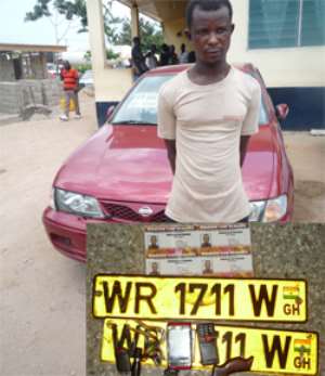 Suspect Kofi Ayensu standing by one of the stolen vehicles. INSET:The retrieved items