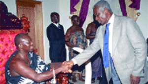 Otumfuo  Osei  Tutu II  welcoming  Brigadier-General  Nunoo-Mensah,  leader  of  the  government delegation, to the Manhyia Palace.