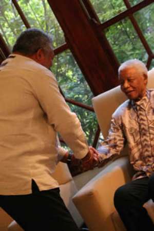 Former President Rawlings congratulating Nelson Mandela when the former visited South Africa recently.