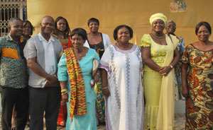 Rev. Campbell kente around neck,Mrs Janet Akyeampong and Dr. Keremanten flanked by guests