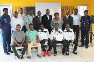Some of the athletes in a pose with GOC officials