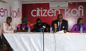 CEO of Hype Records, Mr. Opoku Asafo Adjei Agyeman (in suite) addressing the media at the signing. Sitting to his right in shades is Ruff N Smooth