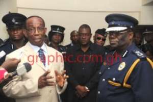Mr William  Aboah, Interior Minster interacting with the IGP, Mr Paul Tawiah Quaye and other police officers during the Minister039;s visit to the Police Headquarters
