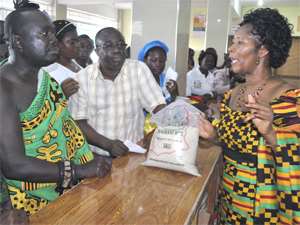Comfort Aniagyei (right) explaining some point to a section of the gathering shortly after the commissioning