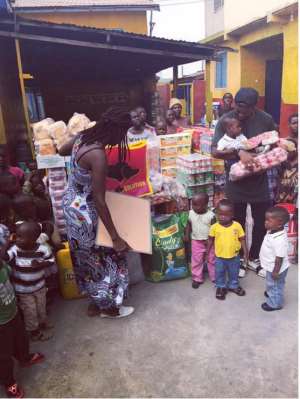 Muniru Sulley interacting with orphans on New Year's Eve.