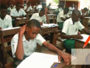 Flashback: BECE candidates busily writing a paper