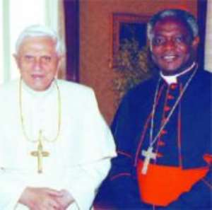 Cardinal Appiah Turkson in a pose with Pope Benedict XIV