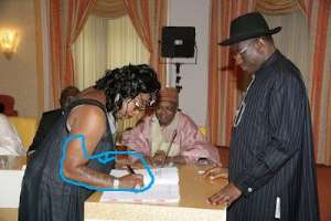 President Jonathan and the tattoo girl.