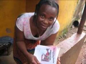 Margaret Bayoh, with her savings book.