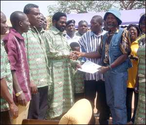 The Accra Metro best farmer receiving his certificate from AMA Boss