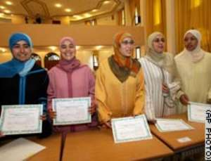 Barrier broken: Women become Muslim preachers(In Morocco, 50 women graduate as 'guides' to promote)
