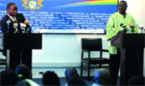 Mr Martin Eson-Benjamin (left), CEO of the Millennium Development Authority, answering questions at the meet-the-press in Accra.  On his left is Information Minister, John Tia Akologu.