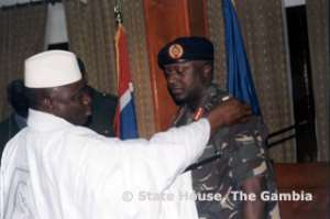Better Days: President Yahya Jammeh decorates his former ally Lt. General Tamba