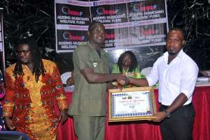 2014 Grand Ball Presents Cheques to AMWeF  Musiga Academy