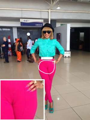 Tonto Dikeh's Airport Pose, You See Color Blocking, But We See...Don't Look If You Are Below 18!