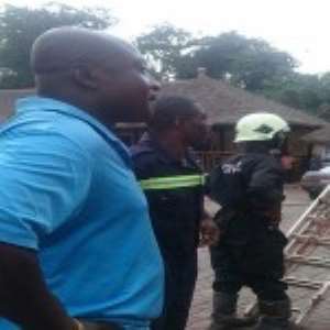 Tony Yeboah looks on with shock as the fire consumes his property