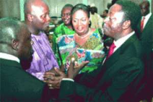 Dr Kwabena Duffuor (right) Finance Minister, interacting with some NPP parliamentarians after presenting the 2010 Fiscal Year Budget to Parliament in Accra.
