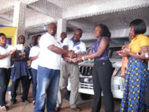 Dr. Harrison, President amp; CEO of Benand Gonow Ghana Ltd., presenting the car keys to Alberta Akorsah