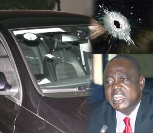 Dr Kunbuor right and his bullet ridden car