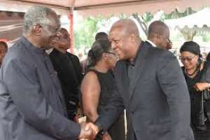 President John Dramani Mahama in a hand shake with Former president Kufour