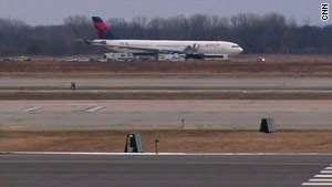 Police met a Northwest Airlines jet in Detroit, Michigan, after reports of a disruptive passenger.