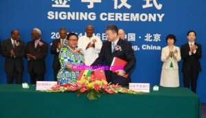 Vice President John Mahama in white witnessing the signing of the 3 billion China loan. The signing was done by Ghana's ambassador to China, Mrs. Helen Mamle Kofi and the Vice President of CDB, Mr. Yuan Li