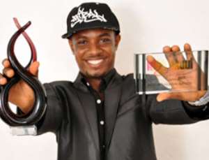 Dr. Cryme displaying the uk award