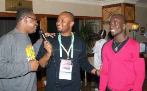 Yaw Ampofo Ankrah middle interviewing some football stars at a recent event