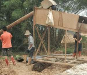 Some Chinese nationals working on a small scale mine