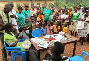 Beneficiary children and volunteers during the registration exercise
