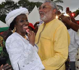 Nana Konadu Agyeman-Rawlings dances with her husband while some 31st December Womens Movement members support them.