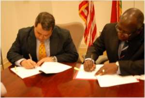 Ambassador Donald Teitelbaum and GCAA Director General Air Commodore Rtd Kwame Mamphey signing the grant