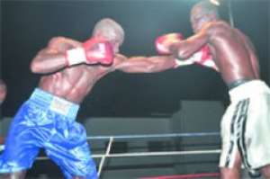 Obodai Sai aims a straight left at Isaac Selorm.