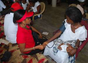 A nursing mother receiving treatment from one of the nurses hired by the Old Vandals