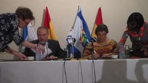Hannah Tetteh and Avigdor Liberman signing the MOUs