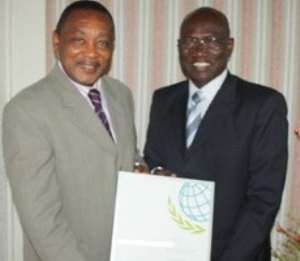 Dr Frank Odoom right, Director General of SSNIT receiving the award
