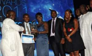 Ken Ashigbey MD of GCGL presenting the best in Retial Banking Award to CAL Bank