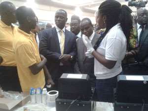 Emmanuel Kofi Armah Buah, Minister of Energy and Petroleum being briefed about how the PPMS works.