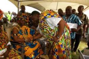 Mr Elvis Afriyie Ankrah, Deputy Minister of Local Government exchanging greetings with Togbega Tatamia Dzekley VII, Paramount Chief of Battor Traditional Area on arrival at the annual Hoogbeza Festival  at Battor