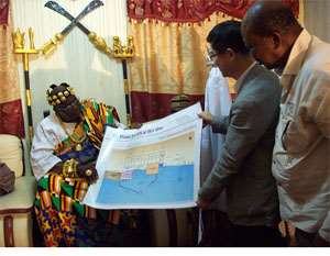 The Awoamefia receiving the proposed habour plan from Shan Seonghan Kim. Looking on is Dumega Raymond Okudzeto right