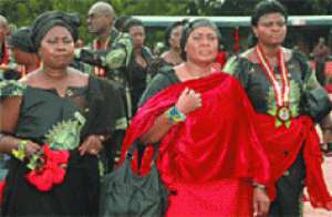 Mrs Getrude Quashigah (middle) and some members of the family arriving at the funeral grounds.