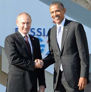 President Vladimir Putin and Presidents Barack Obama in a handshake