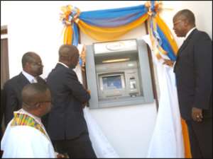 Dominic Donkor (m) and others launching the E-zwich ATM