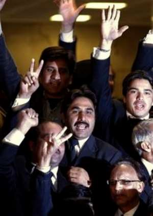 AP – Pakistani lawyers react after the Supreme Courts decision outside the court in Islamabad, Pakistan,