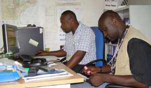 Didace Namujimbo, right, with colleague Serge Maheshe at Radio Okapi offices in 2006. Both were later murdered. (Do Namujimbo)