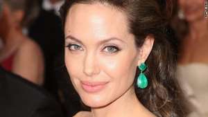 Angelina Jolie has penned an op-ed piece for Newsweek the same day President Obama accepted the Nobel Peace Prize.